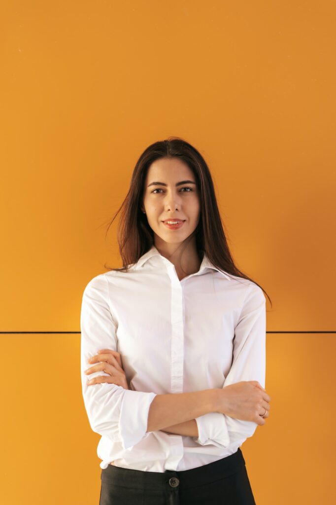 Young woman portrait on yellow background